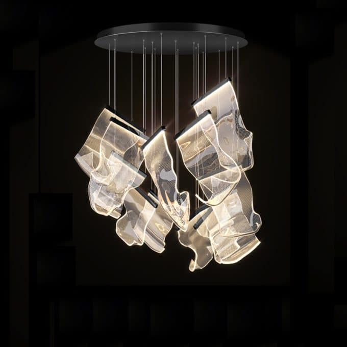 3 Modern mesh design chandelier lighting fixture in a dark room.