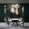 4 Modern dining room with artistic chandelier and forest view windows.