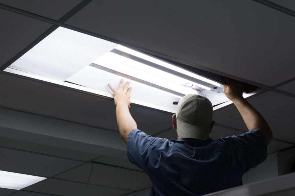 Man Installing New Light Fixture