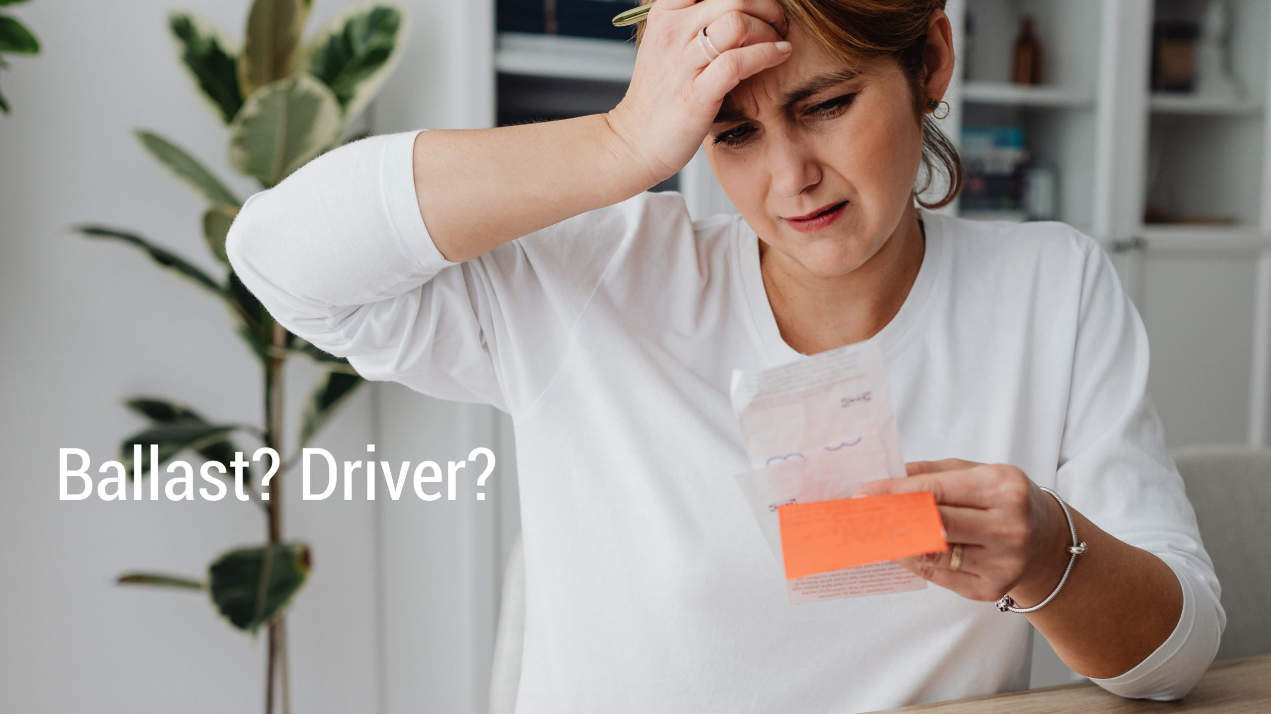 Woman confused with text about ballasts and drivers