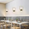 61uJzvQlgzL._AC_SL1000_ Modern dining room with elegant pendant lights and Scandinavian style decor.