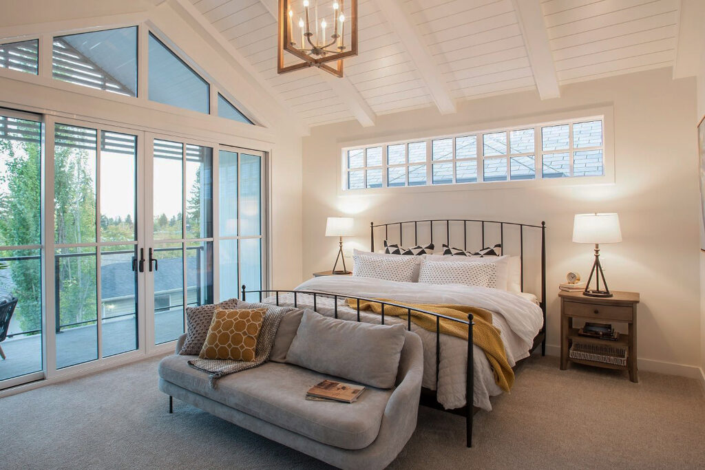 simple wooden chandelier in a high ceiling bedroom