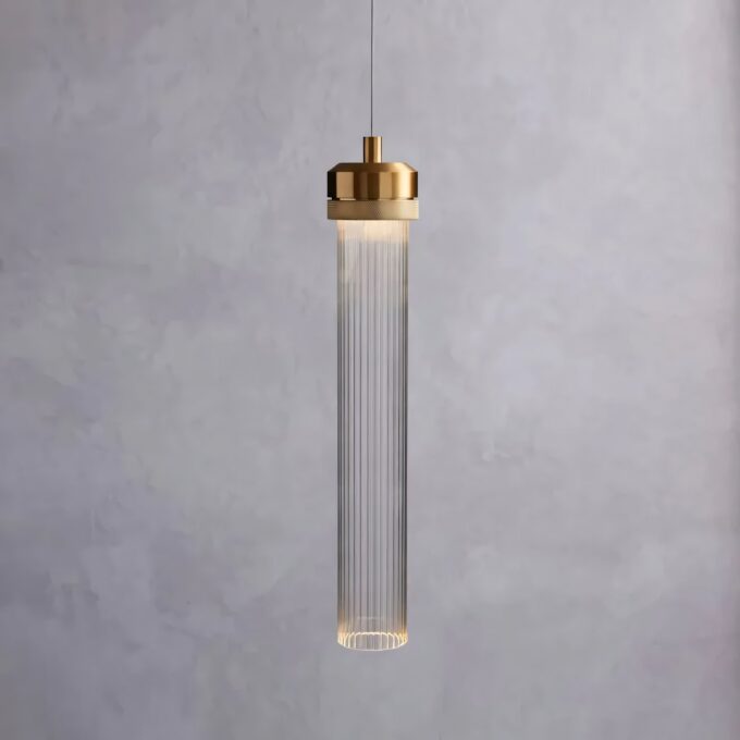 1 Elegant pendant light with brass accents against a grey backdrop.