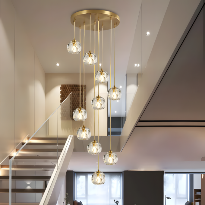2 Elegant modern gold pendant light fixture with glass bulbs illuminating a chic, open-concept living space.