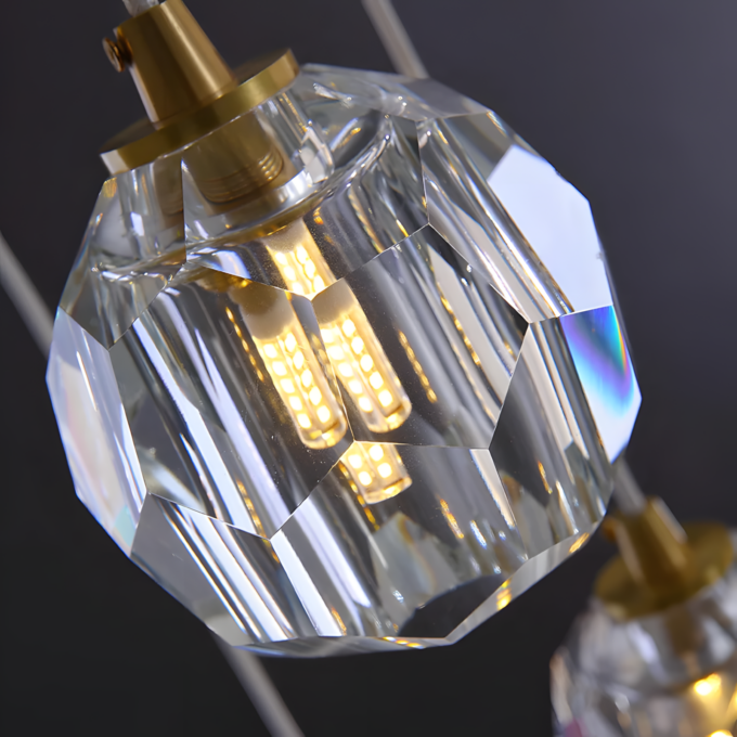 6 Crystal pendant light with LED bulb, close-up, showcasing elegant geometric design and warm illumination.