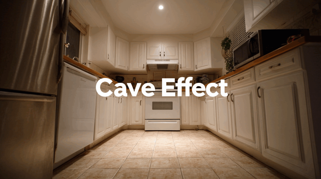 Wide-angle view of a kitchen with white cabinets and 'Cave Effect' text overlay, showcasing spacious design.